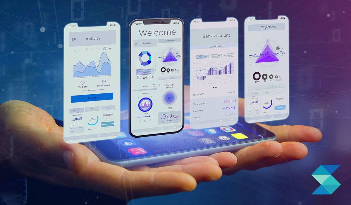 Hand holding a smartphone surrounded by floating banking and analytics dashboard screens, representing fintech app development